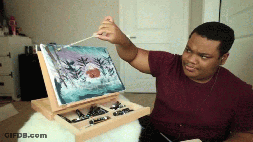 Man Painting On Easel With Brush GIF