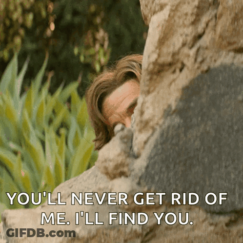 Man Peeking Behind Rock Youll Never Get Rid Of Me GIF