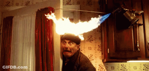 Man Peeking From Behind Door With Flame On Head GIF