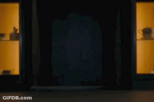 Man Peeking From Dark Room GIF