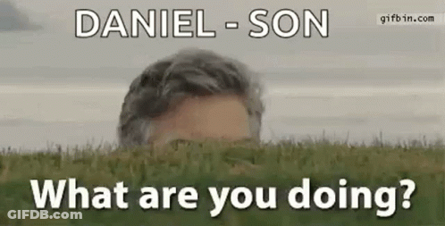 Man Peeking From Green Field Asking What Are You Doing GIF