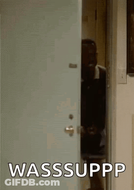 Man Peeking Out Of Door With Wasssuppp GIF