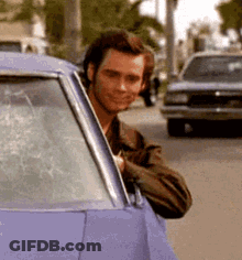 Man Peeking Out Of Purple Car Window GIF