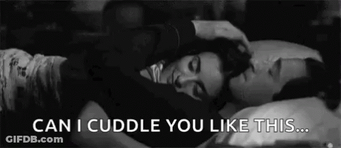 Man Petting Woman's Hair In Bed GIF