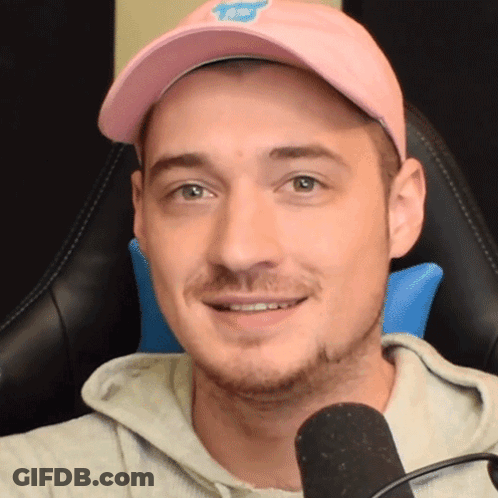 Man Pink Hat Grey Hoodie Smiling Microphone GIF