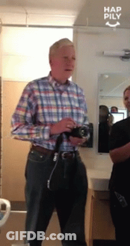 Man Plaid Shirt Holding Camera Had Pily Mirror GIF