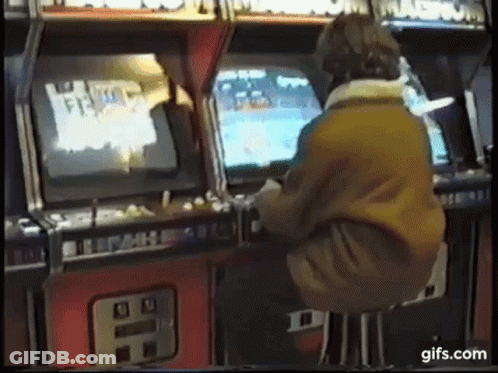 Man Playing Arcade Game GIF
