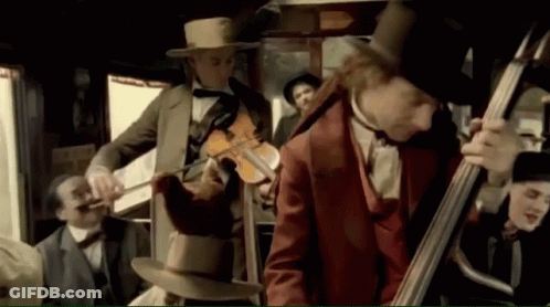 Man Playing Bagpipe In Front Of Crowd GIF