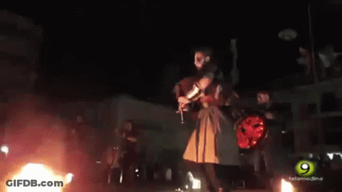 Man Playing Bagpipe In Front Of Crowd GIF