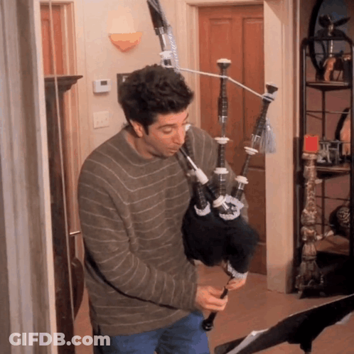 Man Playing Bagpipe On Exercise Bike GIF