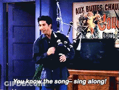 Man Playing Bagpipe With Aux Buttes Chaud Sign GIF