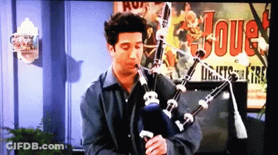 Man Playing Bagpipe With Joue Poster GIF