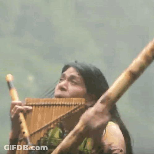 Man Playing Bamboo Flute GIF
