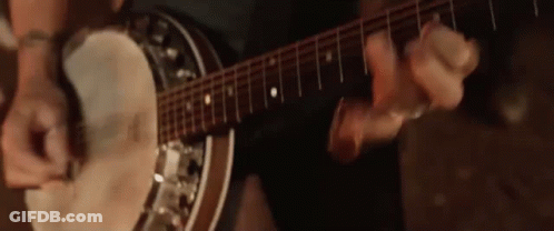 Man Playing Banjo And Guitar In Dark Room GIF