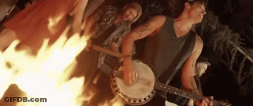Man Playing Banjo In Front Of Group GIF