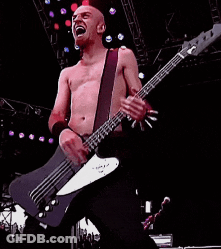 Man Playing Bass Guitar On Stage GIF