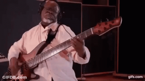 Man Playing Bass Guitar With Headphones GIF