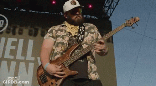 Man Playing Bass Guitar With Rdtime Strap GIF