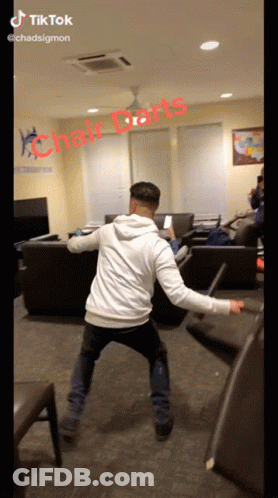 Man Playing Chair Darts GIF