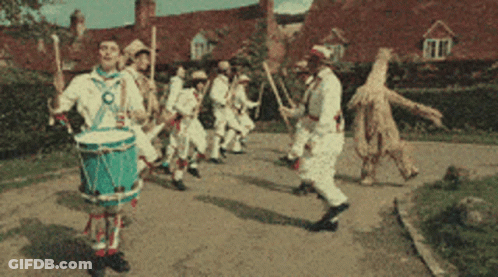 Man Playing Drum In Parade GIF