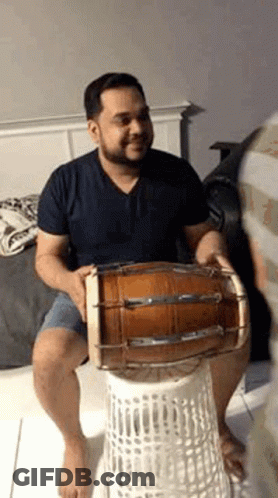 Man Playing Drum On Laundry Basket GIF