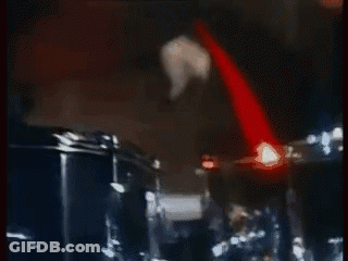 Man Playing Drum Set In Dark Room GIF