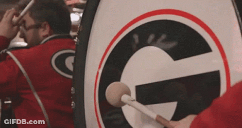 Man Playing Drum With Letter G GIF