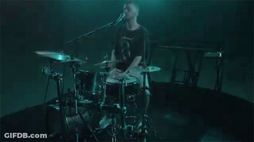 Man Playing Drums In Dark Room GIF