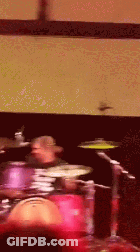 Man Playing Drums In Dark Room GIF