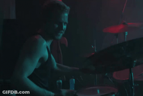 Man Playing Drums In Dark Room GIF