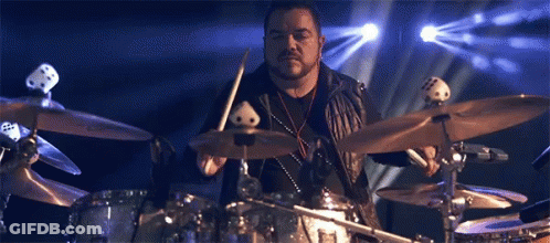 Man Playing Drums In Front Of Blue Light GIF