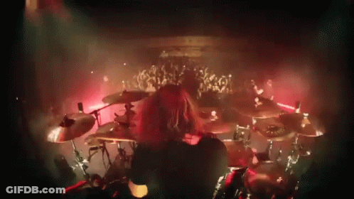 Man Playing Drums In Front Of Crowd GIF
