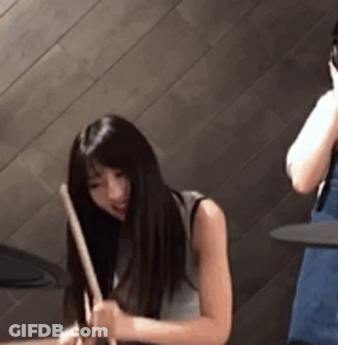 Man Playing Drums In Front Of Sunburn Advertisement GIF