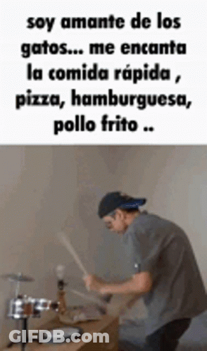 Man Playing Drums In Front Of Table With Spanish Quote GIF