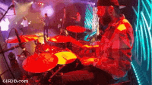 Man Playing Drums On Stage GIF