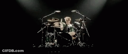 Man Playing Drums On Stage GIF