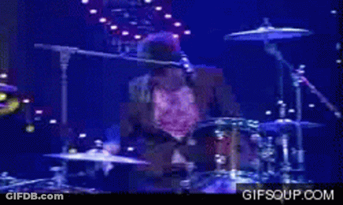 Man Playing Drums On Stage GIF
