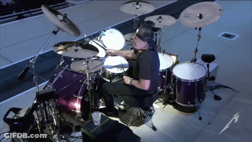 Man Playing Drums With Metallica Logo GIF