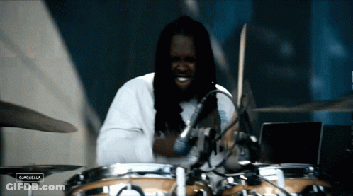 Man Playing Drums With Screen Saying Campbella GIF