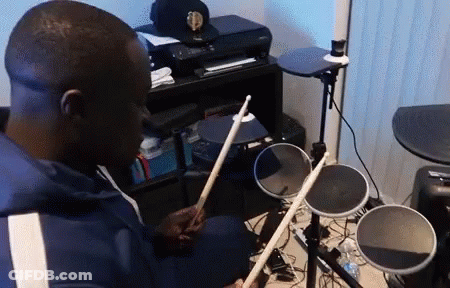 Man Playing Electronic Drums In Living Room GIF