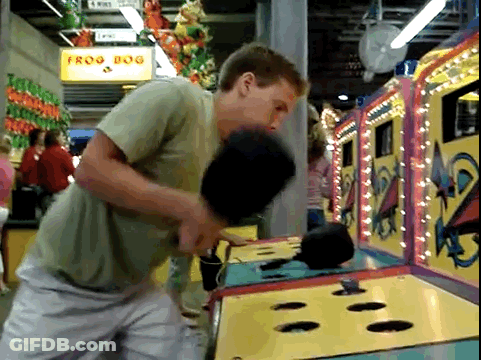 Man Playing Frog Dog At Carnival GIF