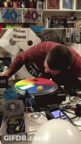 Man Playing Game In Front Of 40 Sign GIF
