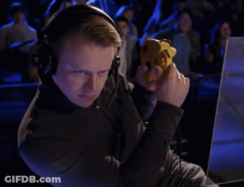 Man Playing Game With Headphones And Yellow Controller GIF