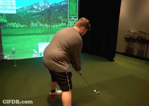 Man Playing Golf With Screen Showing A GIF