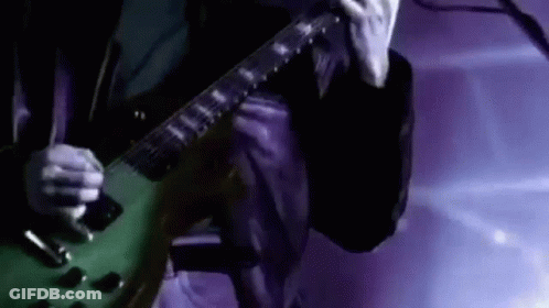 Man Playing Green Electric Guitar GIF