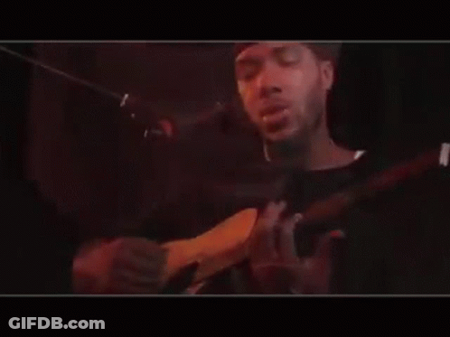 Man Playing Guitar And Singing Into Mic GIF