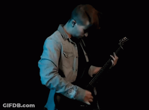 Man Playing Guitar And Singing Into Microphone GIF