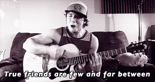 Man Playing Guitar And Singing On Couch GIF