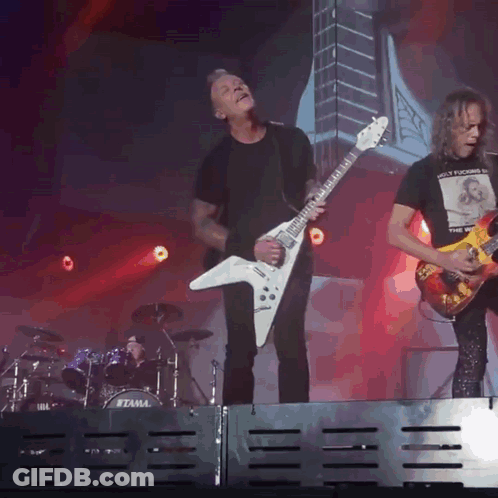 Man Playing Guitar By Tama Drum Set GIF