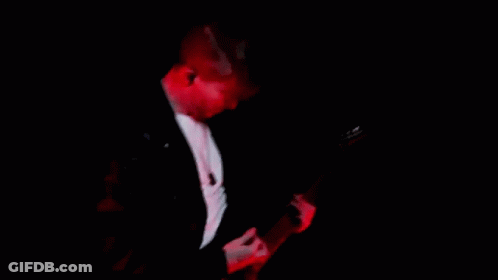 Man Playing Guitar In Dark Room GIF